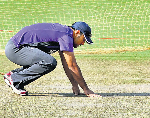 PITCH POSER: M S Dhoni, returning to action after a break, has a tough job to do at the Australian stronghold in Brisbane. FILE PHOTO
