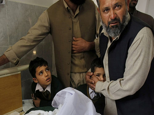 A teenage survivor of Tuesday's Taliban attack on a Pakistan school described how he played dead after being shot in both legs by insurgents hunting down students to kill.Ap Photo