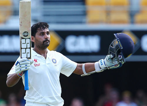 Murali Vijay celebrates after scoring a century on day one of the second cricket test against Australia in Brisbane, Australia, Wednesday, December 17, 2014. AP Photo