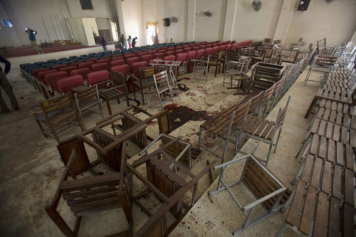 Chairs are upturned and blood stains the floor at the Army Public School auditorium the day after Taliban gunmen stormed the school in Peshawar, Pakistan, Wednesday, Dec. 17, 2014. Pakistan mourned as the nation prepares for mass funerals Wednesday for over 140 people, most of them children, killed in the Taliban massacre in a military-run school in the country's northwest in the deadliest and most horrific attacks in years, officials said. Chairs are upturned and blood stains the floor at the Army Public School auditorium the day after Taliban gunmen stormed the school in Peshawar, Pakistan, Wednesday, Dec. 17, 2014. Pakistan mourned as the nation prepares for mass funerals Wednesday for over 140 people, most of them children, killed in the Taliban massacre in a military-run school in the country's northwest in the deadliest and most horrific attacks in years, officials said. AP
