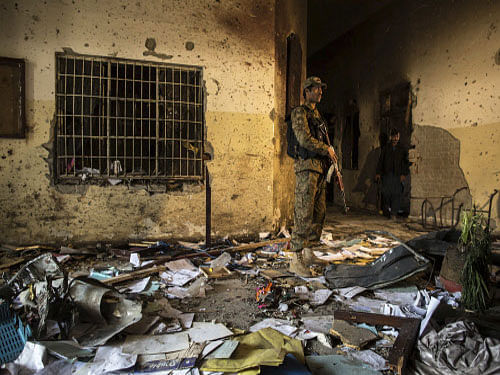 An army soldier stands inside the Army Public School, which was attacked by Taliban gunmen, in Peshawar. Reuters photo