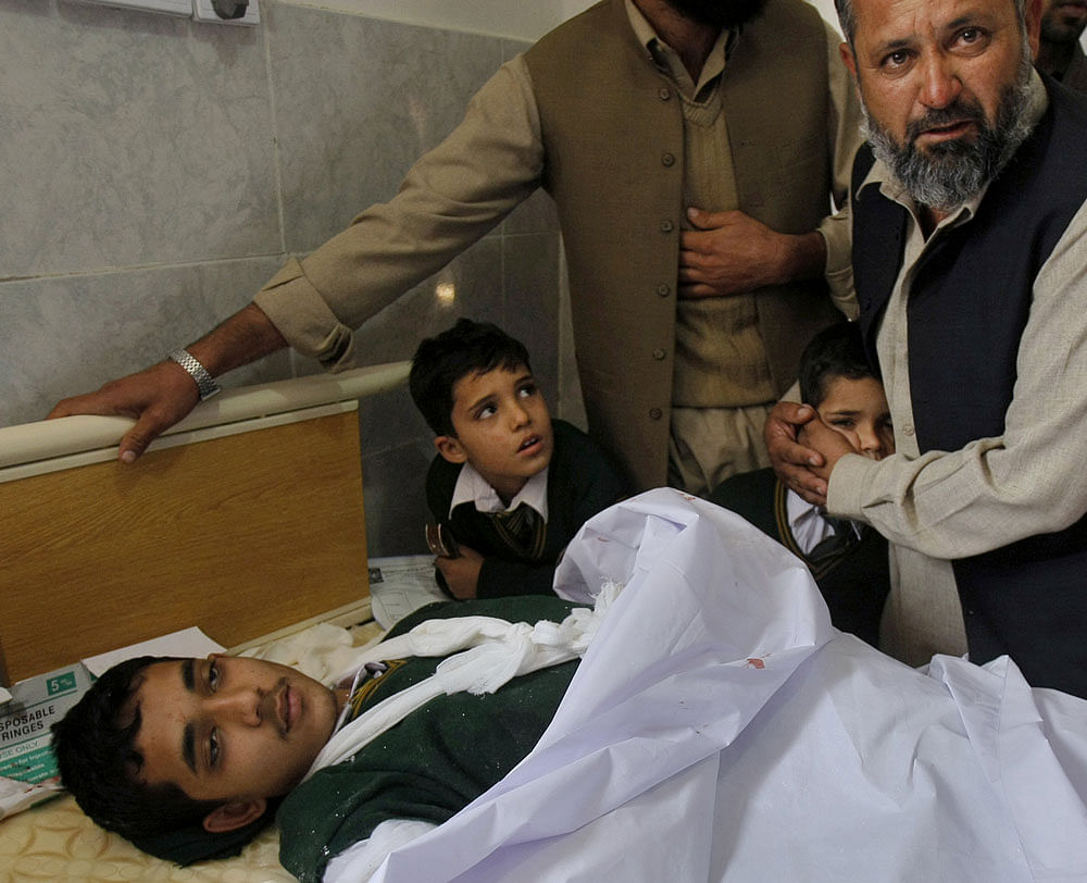 Taliban chief Mullah Fazlullah, his deputy Khalid Haqqani and 14 of the top commanders of the militant group have been named in an FIR in the Peshawar school massacre, even as investigators today visited the site, collected evidence and recorded statements from the survivors. AP file photo