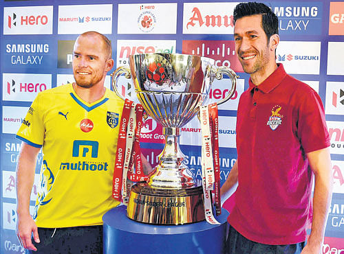 calm before storm: Kerla Blasters' Ian Hume (left) and Atletico De Kolkata's Luis Garcia with the ISL trophy on Friday. PTI