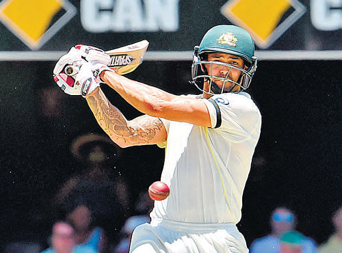 power-packed Australia's Mitchell Johnson flays one to the off-side en route his 93-ball 88 against India on the third day of the second Test at Gabba on Friday. AFP