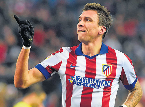 how about that: Atletico Madrid's Mario Mandzukic is delighted after scoring against     Hospitalet in their last 32 second leg clash on Thursday . AFP