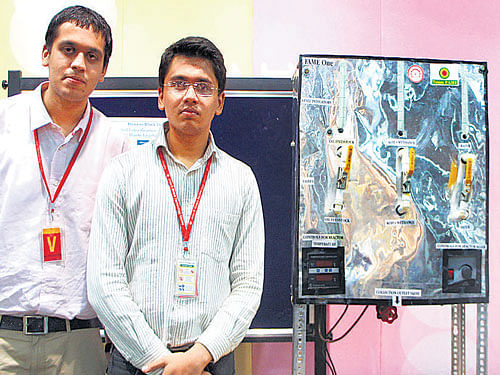 Thewinning teamfromIIT Delhi (left to right)Mohit Soni, Harshit Agarwal and Abhishek Kumar Sharma with their exhibit at the GE Edison Challenge 2014 in the City on Friday. DH PHOTO