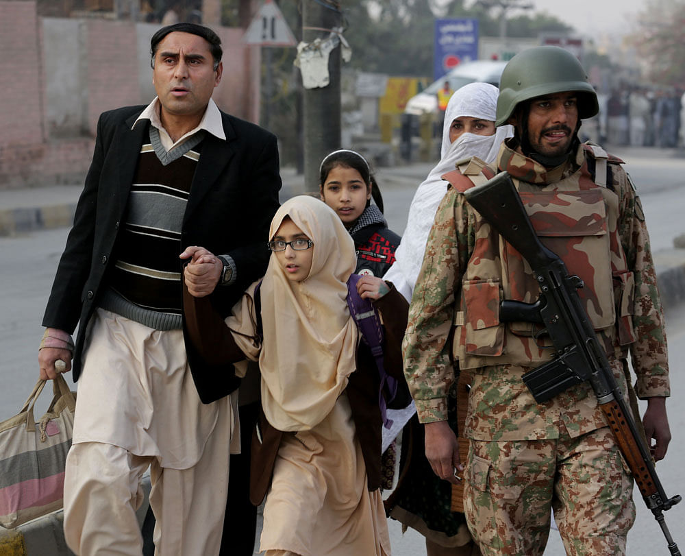 The terrorist who supervised the Peshawar school massacre has threatened more attacks, if the military and the intelligence agencies do not stop anti-terror operations, media reported Saturday. AP file photo