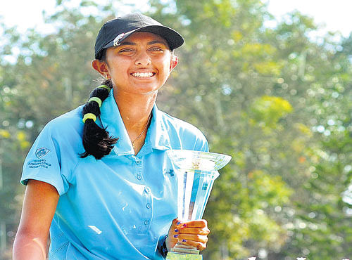 sparkling Aditi Ashok poses with the All India Ladies and Junior Girls Golf Championship stroke play and match play spoils on Sunday at Eagleton. dh photo