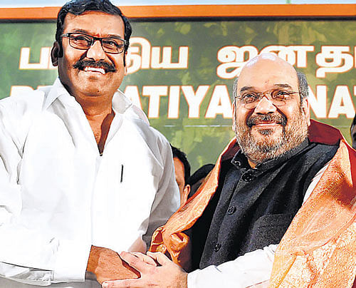 Amid the raging controversy over a conversion bid by some Sangh Parivar outfits, BJP president Amit Shah on Sunday asserted that such incidents would not derail the party-led NDA government from its development agenda. Former Union minister and DMK leader Napoleon greets BJP president Amit Shah after he joined BJP at the party headquarters in Chennai on Sunday. PTI