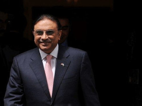 Zardari is in London to persuade his angry son Bilawal to return to Pakistan to attenddeath anniversary of his mother Benazir Bhutto. DH File Photo