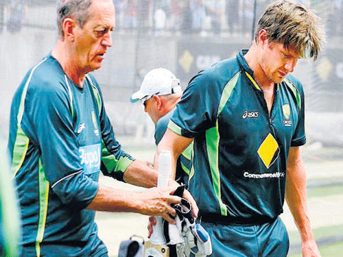 hope you alright? Australian team doctor Peter Brukner attends to Shane Watson at nets on Tuesday.