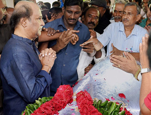Superstar Rajinikanth pays his last respects at the funeral of Dadasaheb Phalke Award winner and a veteran film director K Balachander, at his residence in Chennai on Wednesday. PTI Photo
