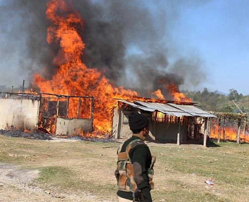 Violence spread in Assam on Wednesday as the toll in the massacre of tribals by Bodo militants rose to 65, including 21 women and 18 children. PTI image