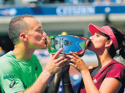 Sania Mirza (right) with Bruno Soares after their triumph in the US Open mixed doubles final in NewYork