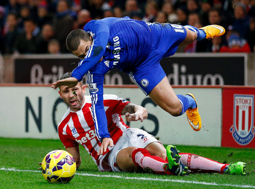 Stoke City's Phillip Bardsley challenges Chelsea's Eden Hazard (top) during their English Premier League soccer match at the Britannia Stadium in Stoke-on-Trent, northern England Reuters file photo