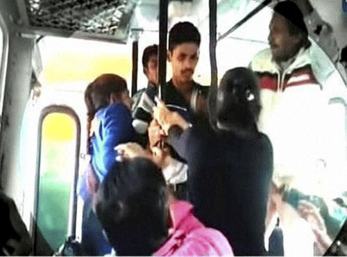 Rohtak sisters thrashing youths in a bus for allegedly molesting them. File photo - PTI