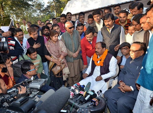 BJP Chief Ministerial candidate Raghubar Das talks to newsmen after his arrival in Ranchi on Wednesday. PTI Photo
