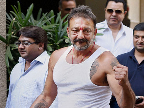 Sanjay Dutt arrives at his residence after he was granted two weeks' furlough by the state prison authorities in Mumbai. PTI photo