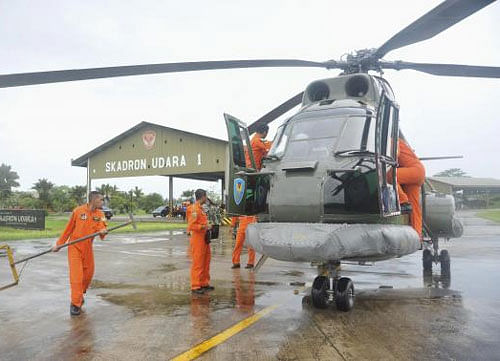 A search and rescue squad from the Indonesian Airforce prepare to depart on a Puma helicopter to take part in the search for the missing AirAsia Flight QZ8501, from a base in Kubu Raya. Reuters photo