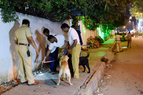 Sniffer Dog squad on spot where a low intensity bomb blast occurred at church street in Bengaluru on Sunday night. PTI Photo