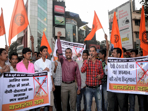 Demanding a ban on Aamir Khan-starrer 'PK' for hurting Hindu sentiments, Bajrang Dal activists today attacked two theatres in the city opposing screening of the Bollywood film.PTI Photo