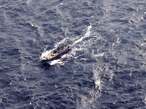 An aerial view of the fishing boat carrying explosives before being intercepted by Indian Coast Guard approximately 365 km off Porbander in Gujarat.The boat eventually drowned after being set on fire by crew members. PTI Photo