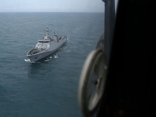 Indonesian navy ship KRI Sultan Hasanudin is seen through the window of a Super Puma helicopter during a search operation for passengers onboard AirAsia Flight QZ8501, off the Java sea, in Indonesia. Indonesian search and rescue teams hunting for the wreck of an AirAsia passenger jet have located the tail of the aircraft underwater, agency chief Fransiskus Bambang Soelistyo told reporters on Wednesday. Reuters photo