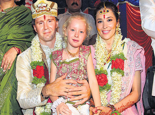 Former Ukraine goalkeeper Vitaliy Hryhorovych Reva, who remarried Elena, his wife of 10 years, according to the Hindu tradition at Neelavara in Udupi district onWednesday. The couple's daughter Vasilisa is also seen. DH PHOTO