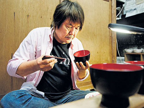 A Crafty connection Japan's celebrated lacquerware craftsman Mitsuru Ishikawa at work; some of the exquisite lacquerware items. (Photo by Jeremie Souteyrat for The New York Times)