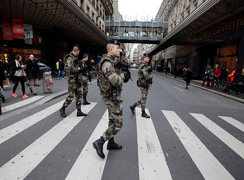 French soldiers patrol in the street near a department store in Paris as part of the highest level of 'Vigipirate' security plan after a shooting at the Paris offices of Charlie Hebdo. Reuters