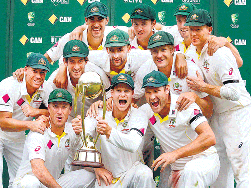 cup is ours: Australian players pose with the Border-Gavaskar Trophy at the SCG&#8200;on Saturday. reuters