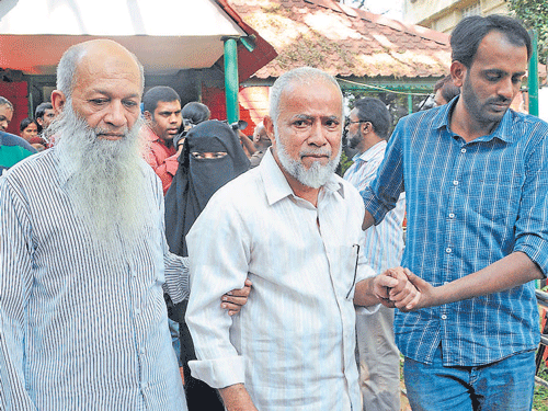Abdus Subur's father Mohammed Hussein (left) and Syed Abdul Aleem's father Dr Syed Ismail Afaq being brought to the Bangalore Press Club, where they addressed the press on the arrest of their sons, on Saturday. DH PHOTO