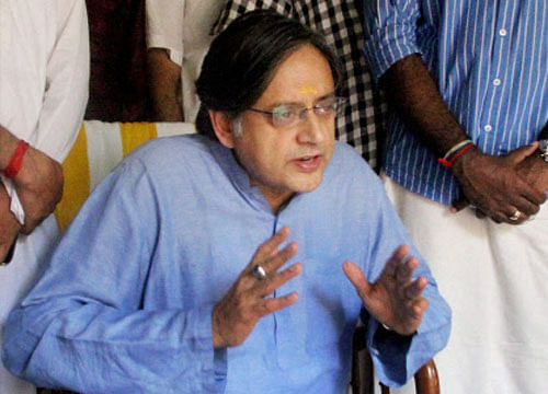 Congress MP Sashi Tharoor today met Ahmad Patel, political secretary to Congress president Sonia Gandhi, during which the issue of Delhi Police filing a murder case in his wife Sunanda Pushkar's death was briefly discussed. Photo: PTI