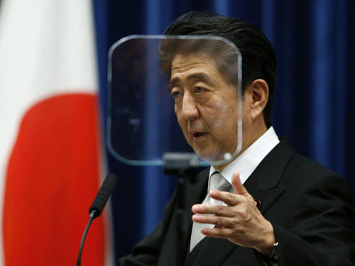 Japanese Prime Minister Shinzo Abe's government approved a record $42 billion military budget on Wednesday, with outlays rising for a third year to counter China's rising military might. Reuters file photo