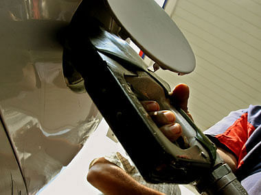 The government on Friday deprived consumers the benefit of a steep cut in fuel prices by hiking excise duty again, the fourth in three months, after oil companies slashed petrol prices by Rs 2.42 and diesel by Rs 2.25 effective Friday-Saturday midnight.  Reuters file photo