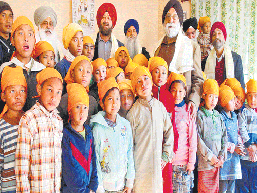 S P Singh Oberoi (in the centre) with Nepali children.