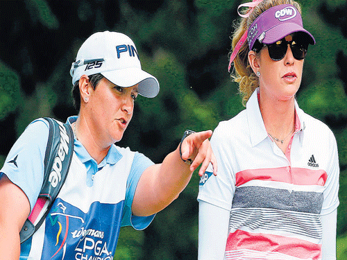 fighting gamely...  Meaghan Francella (left) was a former winner on the LPGA Tour before deciding to become a caddie.