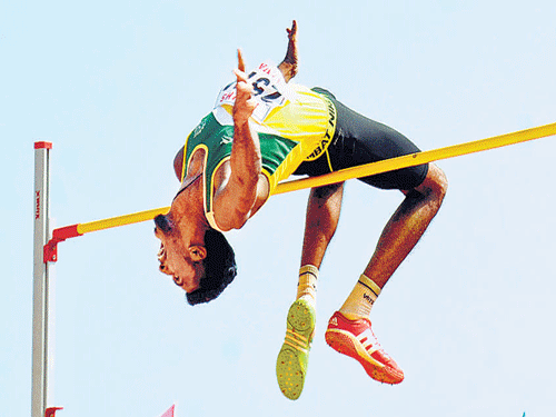 up in the air! Srinith Mohan of Mangalore University wins the men's high jump at the 75th All India Inter- University Athletics Meet on Saturday. DH photo