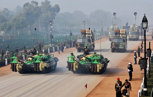 Army tanks move during the rehearsal for the Republic Day parade at Rajpath in New Delhi on Sunday. PTI Photo