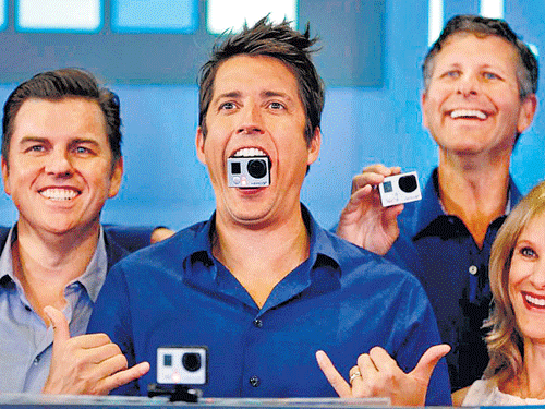 calling for a change: Nick Woodman (centre), the chief executive officer GoPro, celebrated the company's IPO in June, 2014. About 40 per cent more companies went public last year than in the previous year. AP