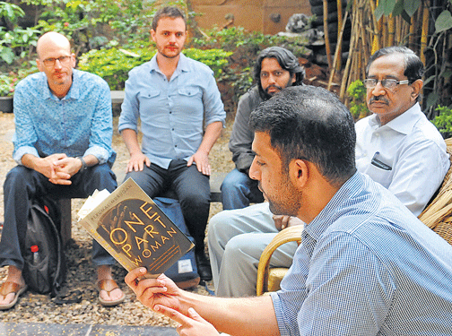 Raghu Karnad reads aloud Perumal Murugan's book 'One Part Woman' at Lekhana 2015 in the City on Sunday. John Magidson, Liam Pieper and K Nalla Thambi are with him. dh photo