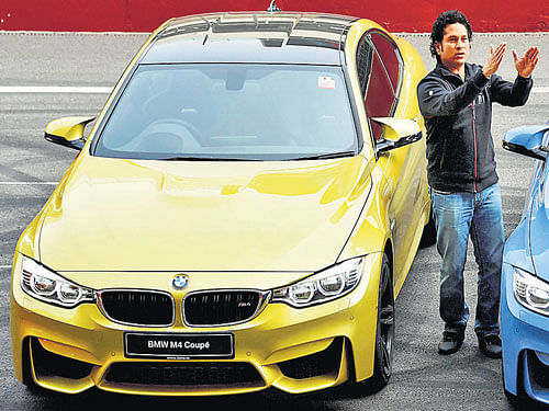 Cricket legend Sachin Tendulkar at the launch of BMW M3 and M4 cars in Greater Noida. PTI