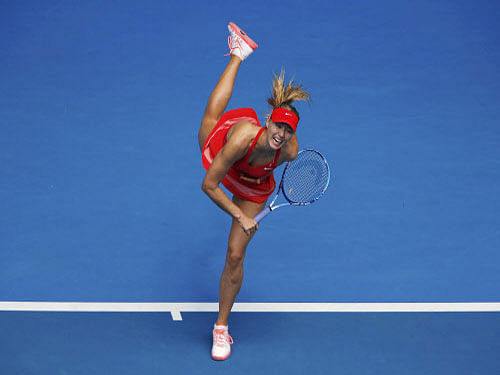 Maria Sharapova serves to compatriot Alexandra Panova during their women's singles second round match at the Australian Open 2015 tennis tournament in Melbourne. The second seeded Russian had a meltdown as the heat was turned up and had to dig deep to save two match points before staging an epic comeback to beat courageous compatriot Alexandra Panova 6-1, 4-6, 7-5. Reuters photo