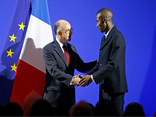 A Muslim man, Lassana Bathily, who saved several shoppers' lives during the Paris terrorist attack has been granted French citizenship.Reuters Photo