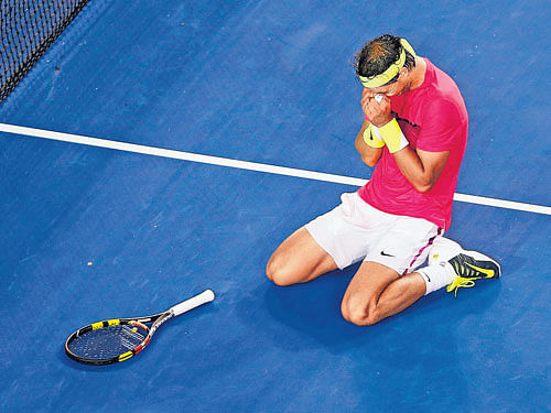 prize fighter: Rafael Nadal can't hide his emotions after fighting off injury concerns in his five-set defeat of Tim Smyczek on&#8200;Wednesday. reuters