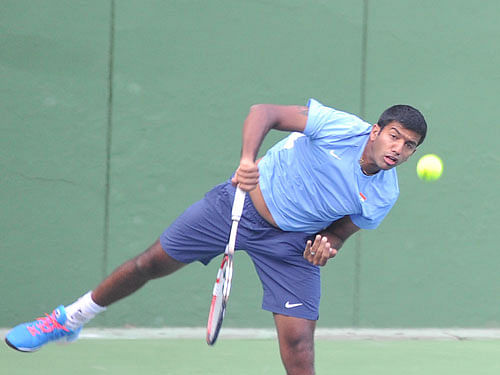 India's Rohan Bopanna and his Canadian partner Daniel Nestor made it through to the second round of the men's doubles at the Australian Open but veteran Mahesh Bhupathi and Austrian Jurgen Melzer lost rather meekly in their opening match here Thursday. Dh file Photo