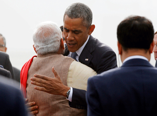 U.S. President Barack Obama hugs India's Prime Minister Narendra Modi as he arrives at Air Force Station Palam in New Delhi. Reuters file photo