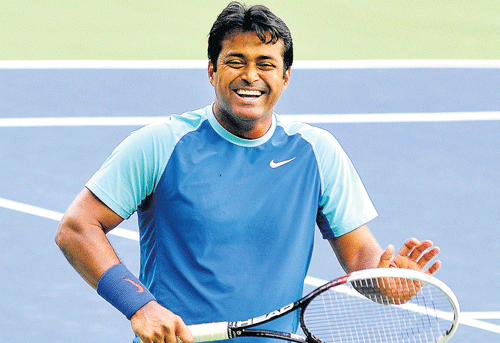 Leander Paes and Martina Hingis won their mixed doubles opener while Rohan Bopanna and Barbora Zahlavova Strycova were knocked out of the competition at the Australian Open tennis tournament here today. DH file photo