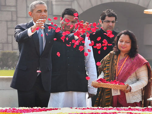 US President Barack Obama paying floral tribute at Mahatma Gandhi's memorial Rajghat in New Delhi on Sunday. PTI Photo