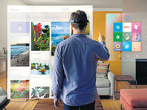 A mixture of holograms and reality, a HoloLens wearer might see. PIC: Microsoft.